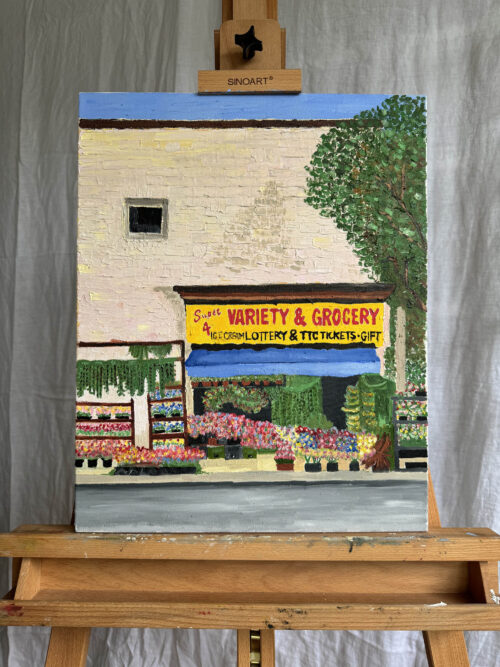 The original painting of the Variety Store in Toronto, Ontario sitting on an easel.