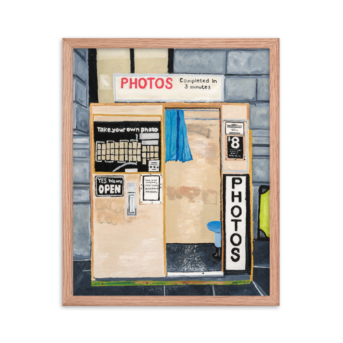 A framed print of Flinders Street photo booth, 16 x 20, red oak.